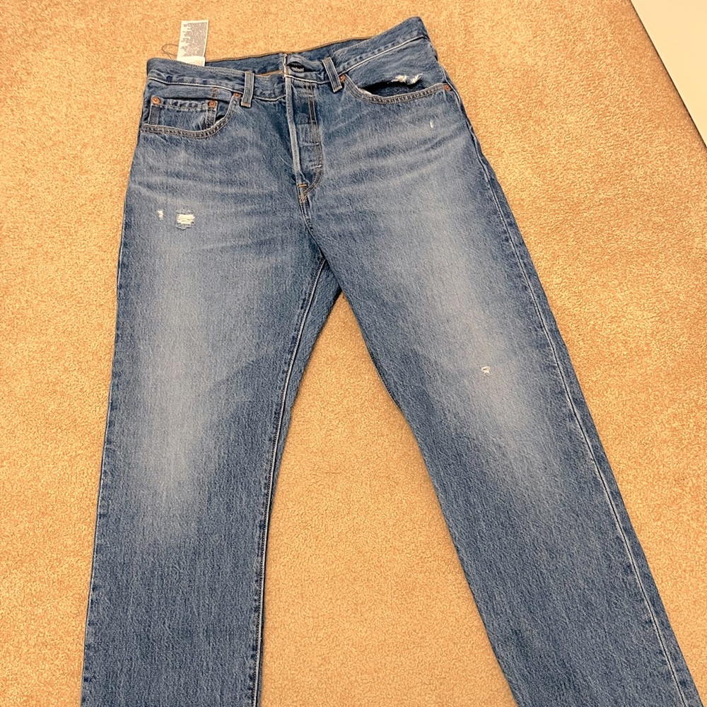 Levi’s 501 women’s jeans. Slight distress, rarely worn. 30 waist, 32 length.